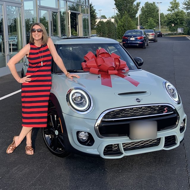 Erin with Elsa, her Mini Cooper, on the day she came home